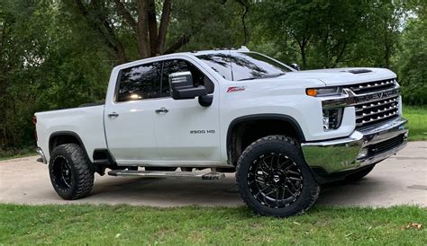 If you can add a slightly negative offset aftermarket rim, it would improve UCA clearance and backspace with no need to do any additional trimming. . 2020 silverado leveled on 35s